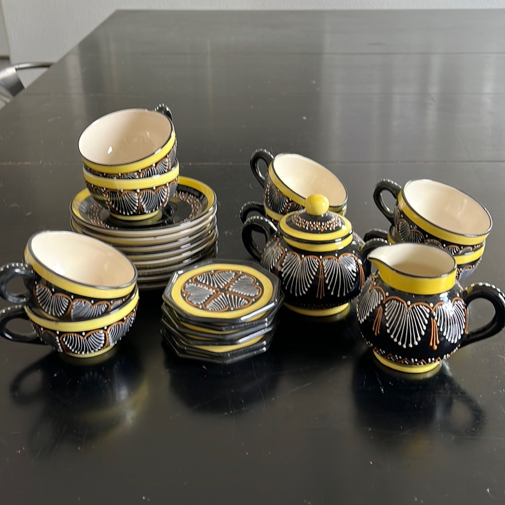 Quimper tea set with 8 cups and saucers, sugar bowl and creamer.